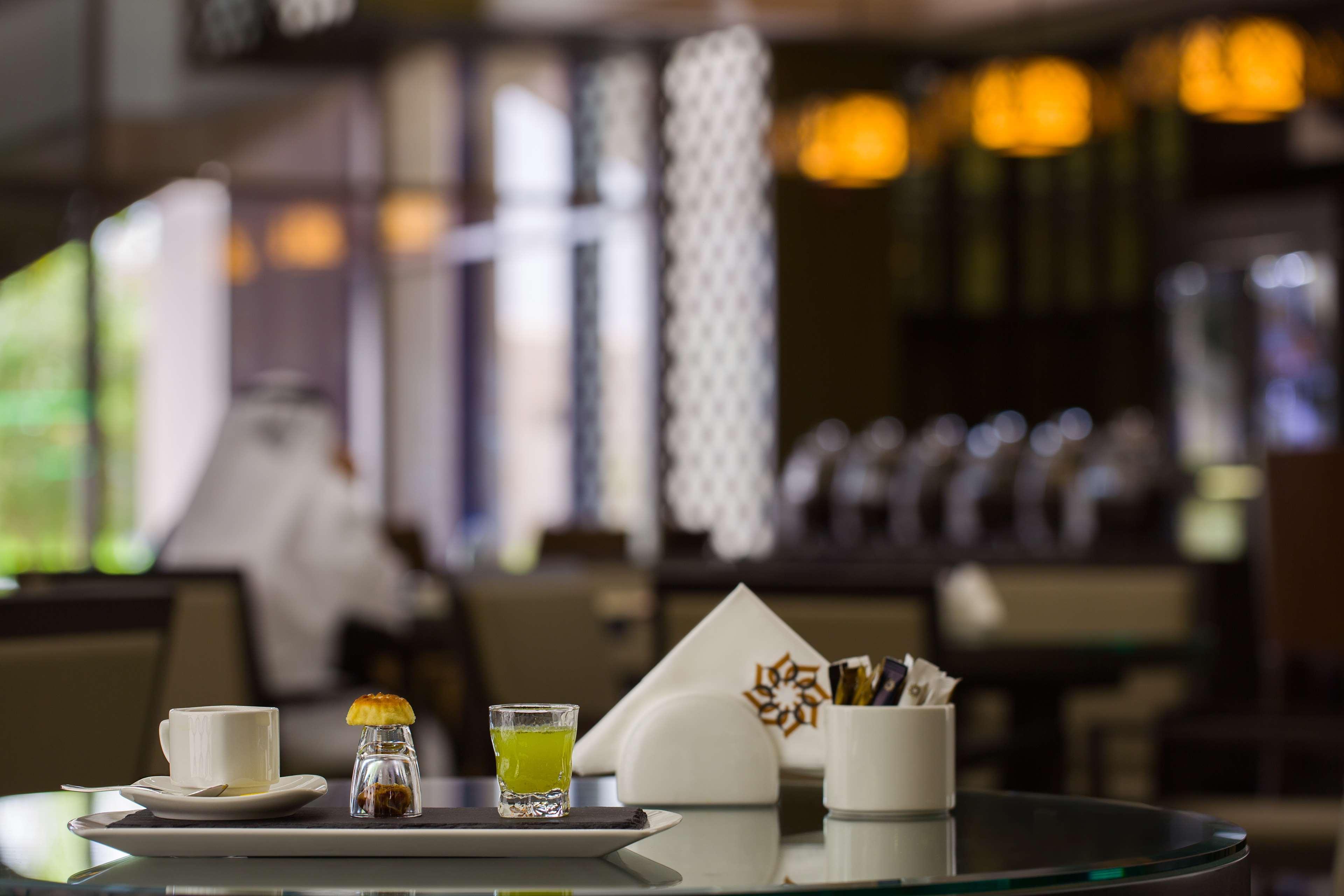 Ayla Grand Hotel Al Ain Exterior foto A table set for service